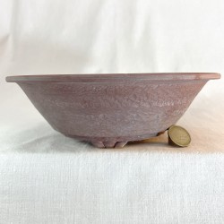 Round stoneware bonsai pot with lip, brick red color with handmade indentation texture.