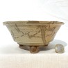 Handcrafted flared round artisan bonsai pot in greenish cream stoneware with dark underglaze dripping
